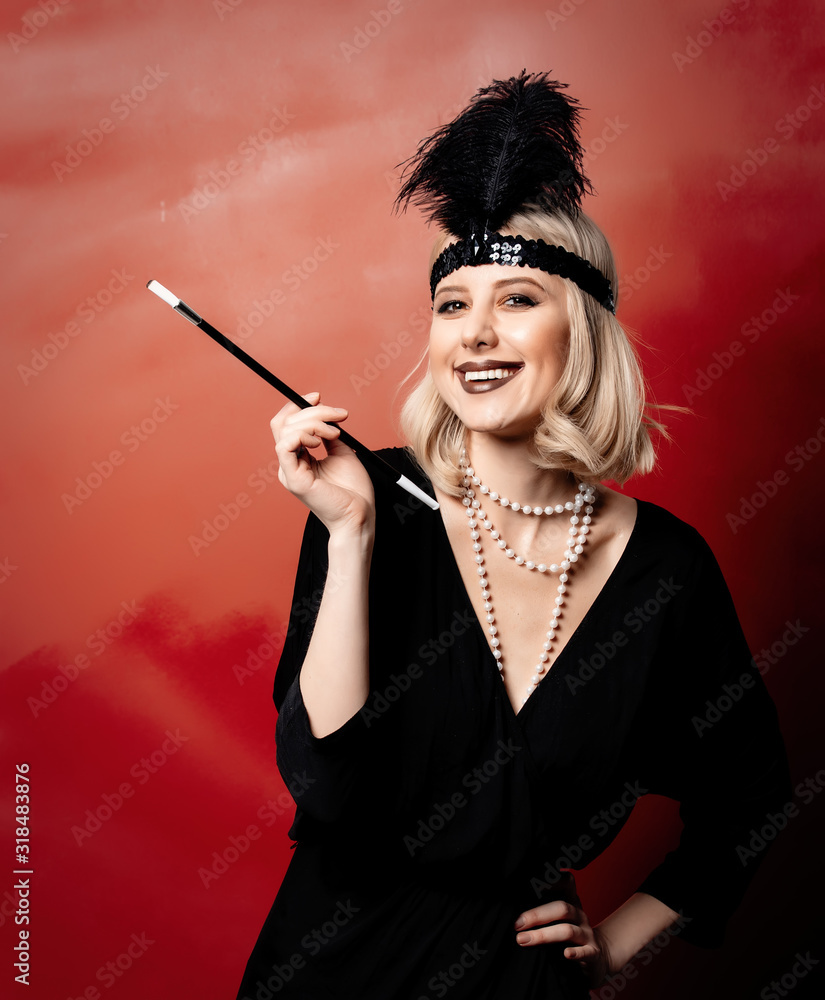 Poster beautiful blonde woman in twenties years clothes with smoking pipe on red background