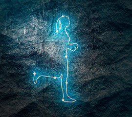 Running woman. Side view silhouette. Sport and recreation concept. Stone surface texture. Neon shine