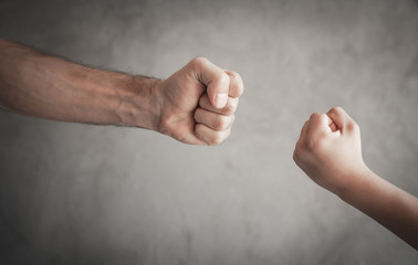 Caucasian aggressive people threatening with fist.