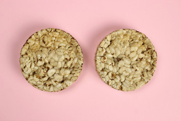 rice, buckwheat Crispbread on a pink background. Diet, proper nutrition, Vegan