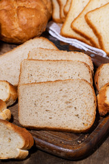 assortment of white fresh bread, vertical