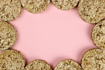 Crispbread frame on a pink background. Space for text. proper nutrition, Vegan
