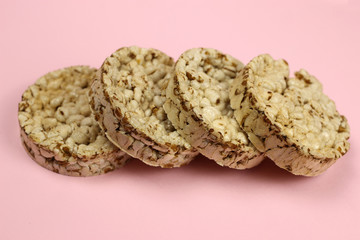 rice, buckwheat Crispbread on a pink background. Diet, proper nutrition, Vegan
