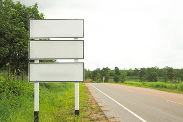 Blank directional road signs with nature landscape in thailand