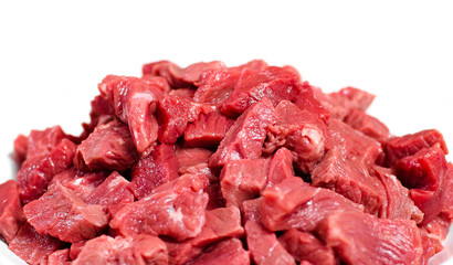 Obraz premium Slices of fresh beef meat on a white background, closeup, isolated, ingredient for cooking