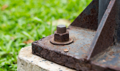 Rusted lighting post steel base plate,  Rusted screw