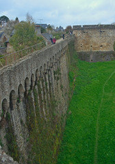 Fototapeta na wymiar View on huge stone walls at Dinan fortress, France