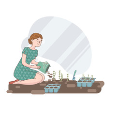 the girl is planting seedlings in the garden..works in the garden, planting