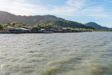 View from the jetty to wooden stilt houses of small town Ban Ko Lanta, once a harbor town, today...