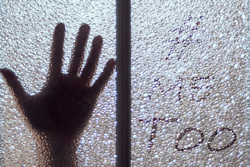 palm behind the glass. on the right on the glass is the inscription "me too"