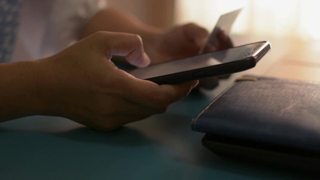 Woman shopping online at home with credit card, Online banking with smart phone, Easy pay using smart phone or digital device.