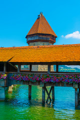 City of Lucerne with Chapel Bridge Tower in a Sunny Day in Switzerland.