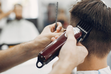 Man with a beard. Hairdresser with a client.