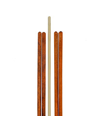 Wooden chopsticks isolated on white background with selective focus