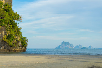 Light blue sky and islands in the background at Hat Chao Mai National Park, Trang, Thailand.