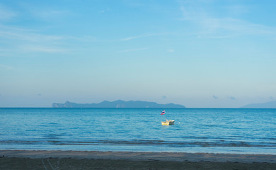 Naklejka premium Light blue sky and islands in the background at Hat Chao Mai National Park, Trang, Thailand.