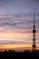Telecommunication tower Antenna at sunset.