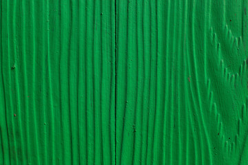 Green wood plank surface abstract texture background with selective focus