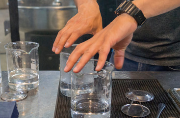 man holds glass glasses with his hands