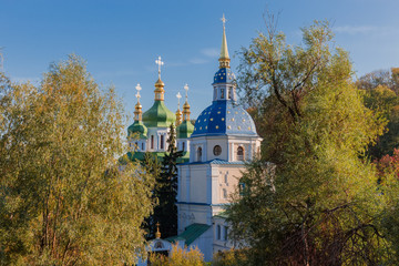 Fototapeta na wymiar Domes of temples of the medieval Vydubychi Monastery, Kyiv, Ukraine