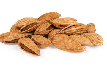 Unshelled mountain almonds close-up on a white background