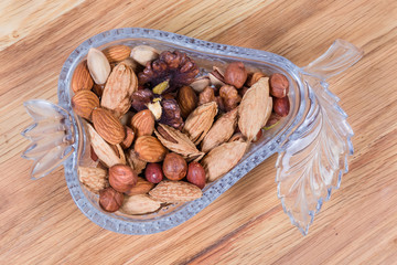 Top view of the various nuts in glass decorative bowl