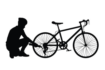 Young man with bike silhouette
