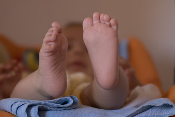 Healthy baby feet in the cradle, beautiful childhood as infant