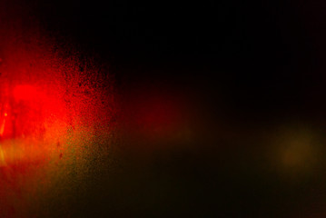 red bokeh light at the window
