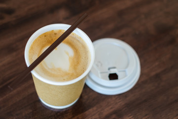 cup of coffee on wooden table