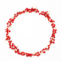 Red currant berries frame on a white backgroundRed currant berries frame on a white background