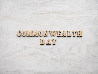 Commonwealth Day. Beautiful, bright card. Isolated background, close-up, view from above. Congratulations for relatives, friends and colleagues