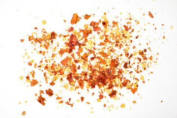 Red chilly flakes top view isolated on white background with clipping path 