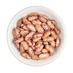 Pinto beans in bowl isolated on white background