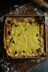 Delicious homemade pizza on table on black background