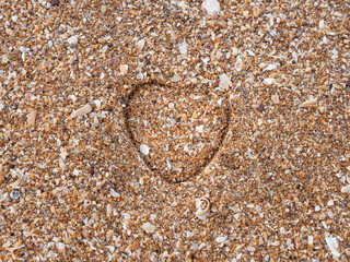 Heart impression on a sand