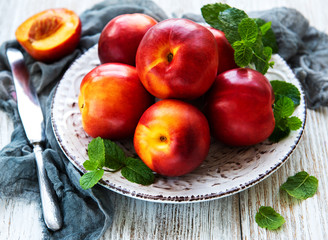 Plate with fresh nectarines