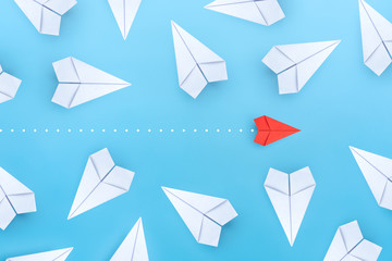 Small business concept with small red paper plane on blue background