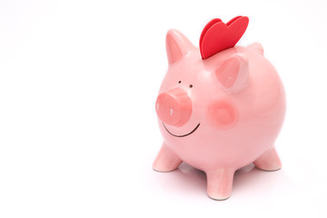 Two red heartas on a piggy bank