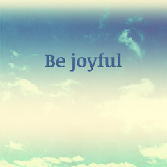Naklejka na ściany i meble Textured sky background image depicting the word: Be joyful