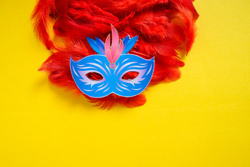 Carnival mask on yellow background 