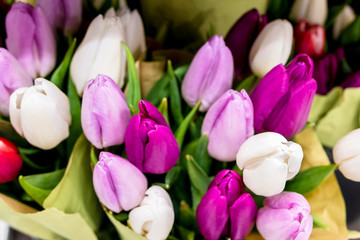 Bouquets of tulips in the supermarket. Holiday Gifts