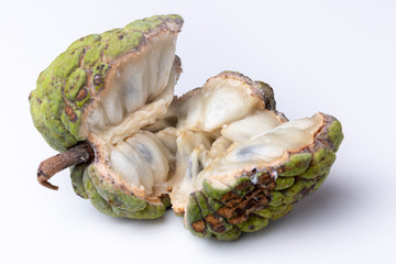 Sugar-apple or 'Fruta de Conde' [Earl Fruit] as it is known in Brazil on a white surface with its...