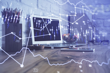 Double exposure of chart and financial info and work space with computer background. Concept of...