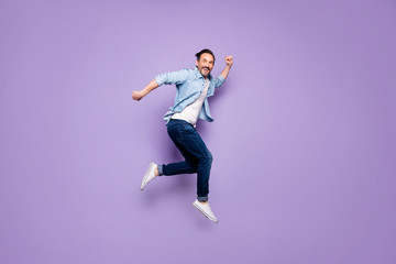 Full body profile side photo of crazy cheerful man jump have rest relax run after spring time sales...