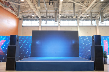 Empty small blue stage for concerts with speakers
