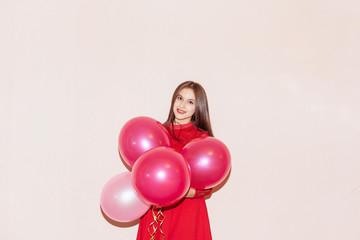 happy and beautiful lady holds air balloons. valentines day, birthday, womens day, anniversary, holiday celebration concept