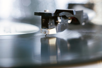Fototapeta na wymiar retro-styled record player spinning vinyl. Close up. selective focus, retro style