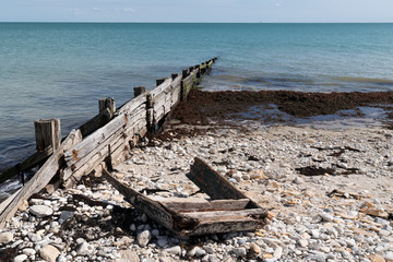 wreck of wooden boat on beach in cap ferret Arcachon bay in France