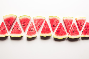 Slice of ripe and juicy watermelon , isolated on white. Top view.